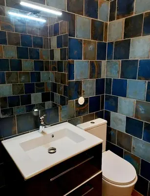 a bathroom with a sink and a toilet at Les chambres d'hôtes du Relais d'Aguilar in Tuchan