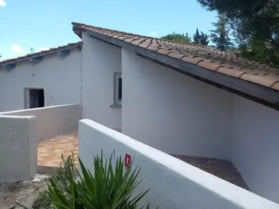 a white house with a tile roof at Les chambres d'hôtes du Relais d'Aguilar in Tuchan