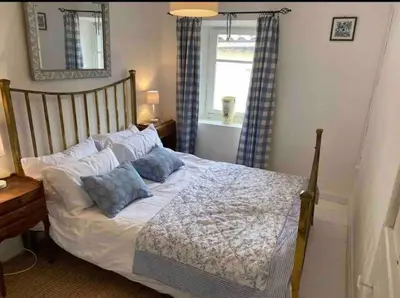 a bedroom with a bed with two pillows on it at Cheerful, traditional 3 bedroom home in Quillan in Quillan