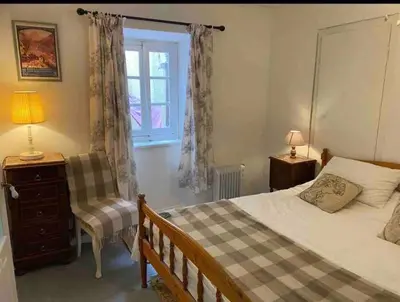 a bedroom with a bed and a window at Cheerful, traditional 3 bedroom home in Quillan in Quillan