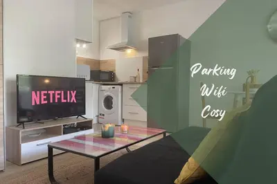 a living room with a tv and a coffee table at Studio Cosy - Balcon - Wifi - Free parking in Narbonne