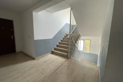 a staircase in a white room with a stair case at Studio Cosy - Balcon - Wifi - Free parking in Narbonne