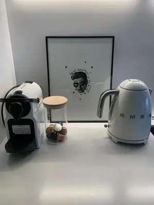 a coffee maker and a toaster sitting on a counter at Gîte au pied de la Cité Médiévale - Le 127 in Carcassonne