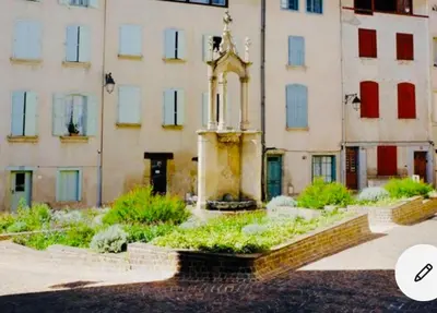 a building with a fountain in front of a building at Maison centre historique Le Préau saint Jacques in Castres