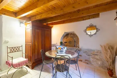a dining room with a table and chairs at Le Gîte Dame Nature in La Tourette-Cabardès