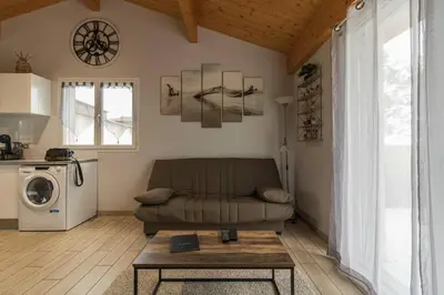 a living room with a couch and a table at Gîte à la Ferme de la Bouriette in Revel