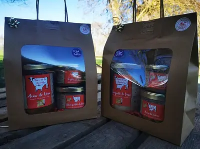 two bags of food are sitting on a table at Gîte à la Ferme de la Bouriette in Revel