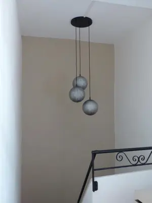 two lights hanging from the ceiling in a room at L'Incarnat in Caunes-Minervois