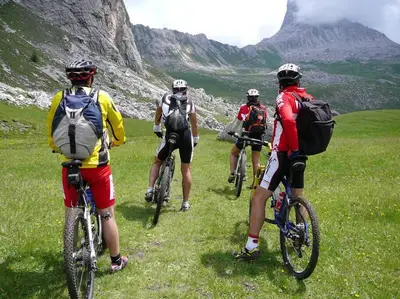a group of people riding bikes on a grassy hill at Spacious stone village house in Puivert in Puivert