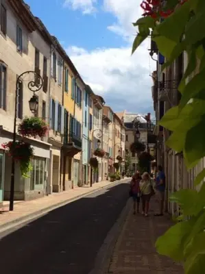 a group of people walking down a street at Riverside 4 bed house full of character and charm in Quillan