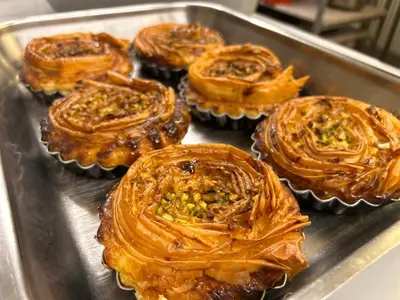 a group of cupcakes sitting in a metal tray at Notre-Dame d'Escouloubre Sources d'eaux chaudes privées et sauna in Escouloubre