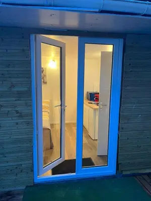 a sliding glass door of a room with a bedroom at Abrilove in Castres