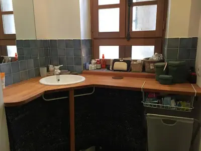 a bathroom with a sink and a counter top at Charme Zen Ecrin de verdure Fraîcheur Spa in Pezens