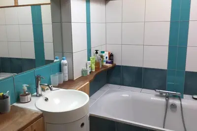 a bathroom with a sink and a bath tub at Charme Zen Ecrin de verdure Fraîcheur Spa in Pezens