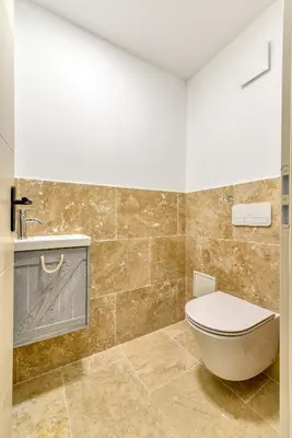 a bathroom with a toilet and a sink at L'appenti in Luc-sur-Orbieu