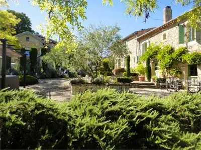 a garden of a house with plants at Villa - Mas de campagne prestigieux- Authentic french countryhouse in dream countryside in Algans