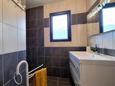 a bathroom with a sink and a window at Panorama in Rieux-Minervois