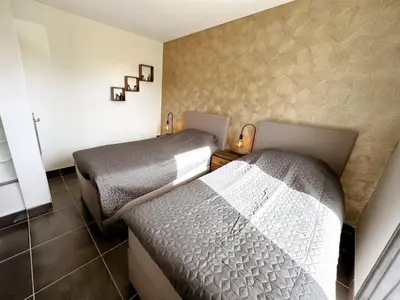 two beds in a small room with at Panorama in Rieux-Minervois