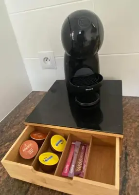 a coffee maker sitting on top of a table at Appartement - 2 chambres - Parking voiture in Mazamet
