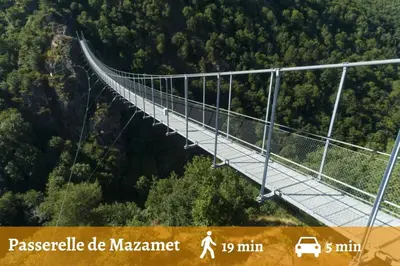 a suspension bridge in the middle of a forest at Appartement - 2 chambres - Parking voiture in Mazamet