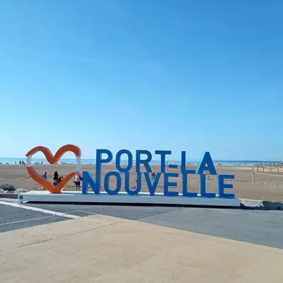 a sign that reads porta nouveau at the beach at Mobil Home de Marine in Port-la-Nouvelle