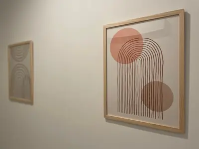 two framed photographs of a painting on a wall at Studio Le Cilaos, au cœur de Castres in Castres