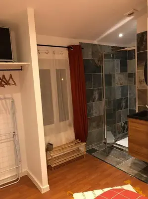 a bathroom with a shower with a glass door at Charmant T2 climatisé - Près des plages in Narbonne