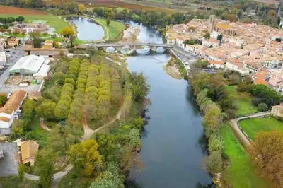 an aerial view of a river in a city at La Casa de Gaëlle 2 in Trèbes