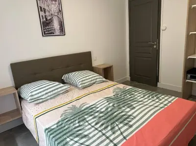 a bedroom with a bed with two pillows on it at La Casa de Gaëlle 2 in Trèbes