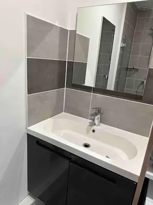 a bathroom with a white sink and a mirror at La Casa de Gaëlle 2 in Trèbes