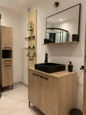 a bathroom with a sink and a mirror at Location de vacances à Quarante Gîte de la cave Szymczak in Quarante