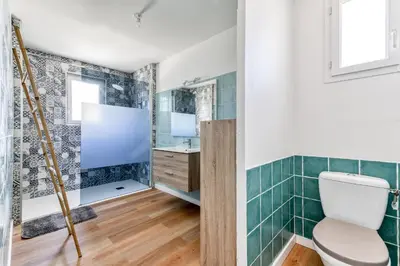 a bathroom with a toilet and a shower at La Villa d'Isa et Seb in Narbonne