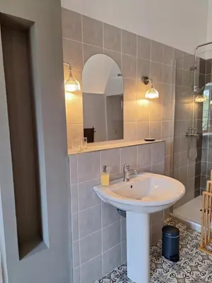 a bathroom with a sink and a mirror at domaine de Capoulade in Narbonne