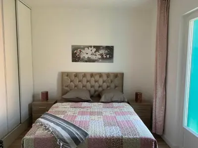 a bedroom with a bed with a quilt on it at Appartement Les Halles 2, Climatisation, Terrasse, Garage in Narbonne