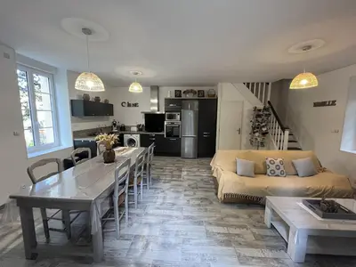 a living room with a couch and a table in it at la Tour du Grand DUC in Cenne-Monestiès