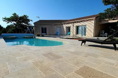 a swimming pool in front of a house at Villa 140 m² hab. avec piscine in Castres
