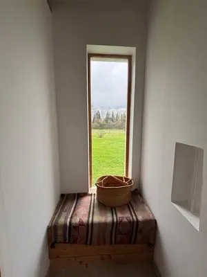 a window in a room with a basket on a chest at Lodge with private pool surrounded by vineyards in Azille