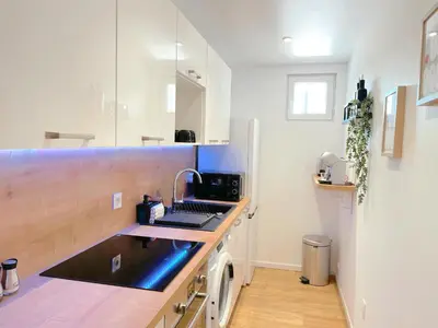 a kitchen with a sink and a counter top at L'intemporel - Grand T2 Confort en Hypercentre in Castres