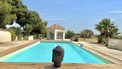 a house with a swimming pool with a gazebo at Domaine Ô Lingot d'Oc in Roubia