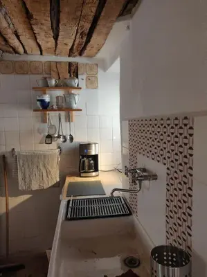 a kitchen with a sink and a coffee maker at VILLA VILATA A PADERN DANS LES CORBIÈRES SAUVAGES in Padern