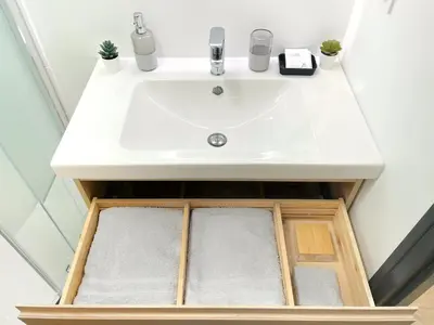a bathroom sink with a drawer underneath it at L'alouette - Studio Duplex Confort en Hypercentre in Castres