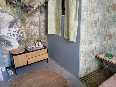 a room with a dresser and a wall at Les Toiles du Figuier in Espéraza