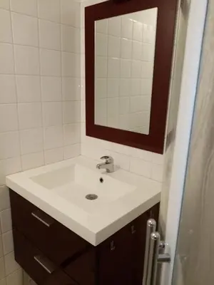 a bathroom with a white sink and a mirror at Les Toiles du Figuier in Espéraza