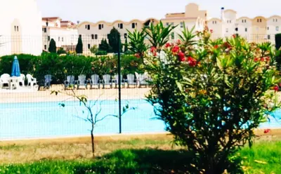 a view of a swimming pool at a resort at Petit appart sympa clim piscine balcon in Gruissan