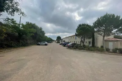 a street with cars parked on the side of a road at Maison au cœur des Corbières in Saint-Laurent-de-la-Cabrerisse