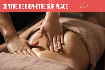 a woman getting a spine massage on her stomach at Domaine La Belle Histoire - Gîte côté jardin in Besset