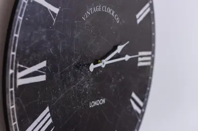 a close up of a clock on a wall at Charmant duplex Castelnaudary in Castelnaudary
