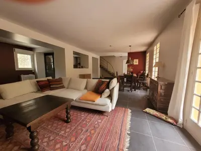 a living room with a couch and a table at Casa Allègre in Aigne