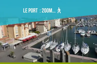 a group of boats docked in a marina at L'Escale de la Plage in Gruissan