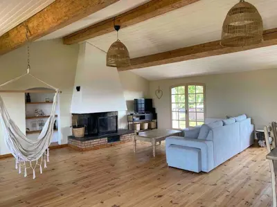 a living room with a couch and a fireplace at Maison de village in Fanjeaux